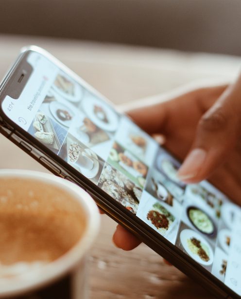 A person scrolling through social media on a smartphone