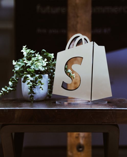 A Shopify logo on a table in a store