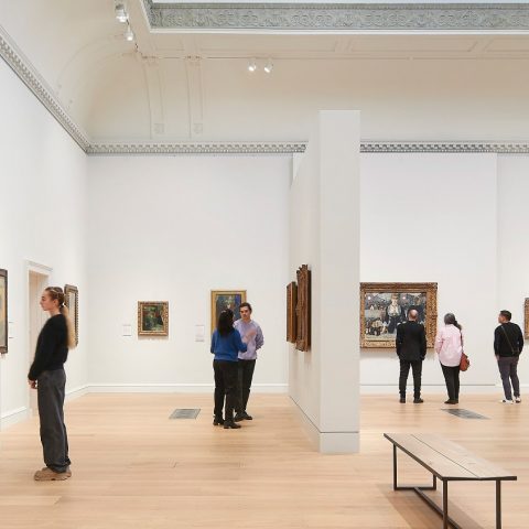 Visitors viewing art in a gallery.